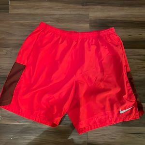 Red Nike athletic shorts